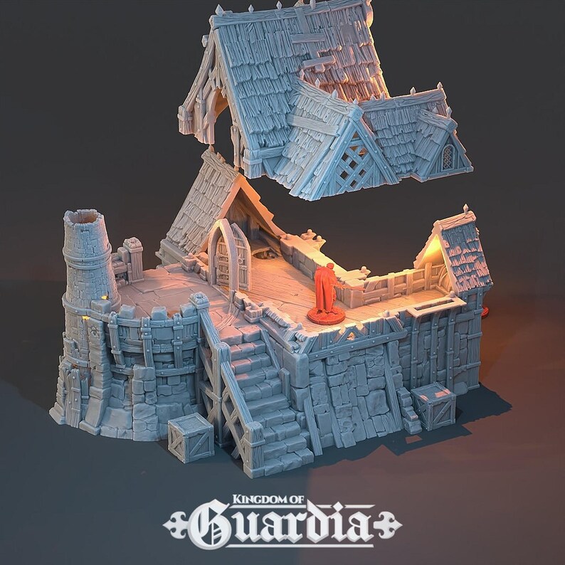 A gray 3D-printed miniature of a blacksmith's lodge with the roof detached and floating above the second story, revealing the interior layout and a red-robed figure.