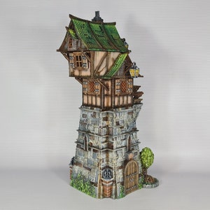 May include: A miniature model of a crooked, multi-level building with a green roof, stone walls, and wooden accents. The building has a small door and windows, and a small tree is growing next to it.