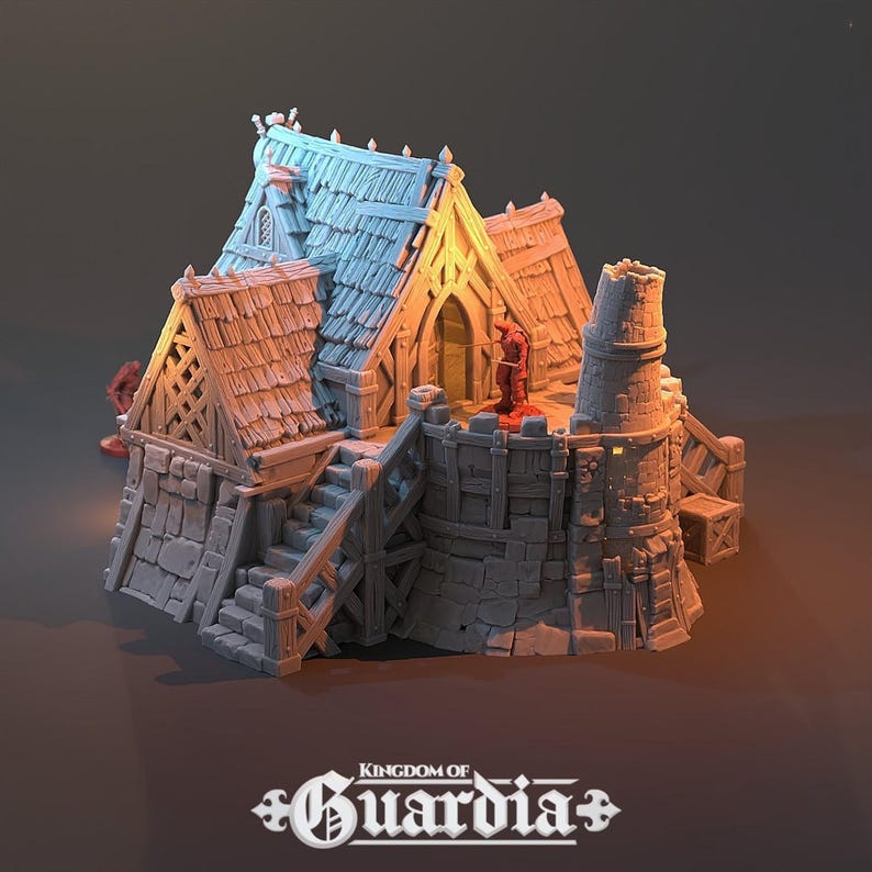 A gray 3D-printed miniature of a two-story blacksmith's lodge from a lower angle, showing a red-robed figure on the second story balcony.