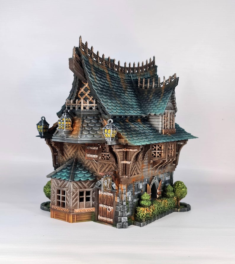 May include: A detailed miniature fantasy house with a multi-tiered roof, featuring a combination of wood, stone, and green roofing tiles. The house has multiple windows, decorative lanterns, and a small garden. The overall design is reminiscent of a medieval or fantasy setting.