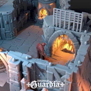 A gray 3D-printed miniature of an interior section of the blacksmith's lodge, showing a red-robed figure near a glowing forge and stacked metal bars.