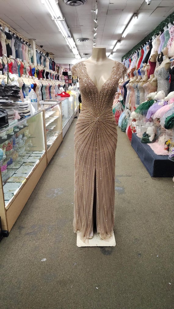 Fitted V-neckline sheer bodice and linear beaded motif with front slit