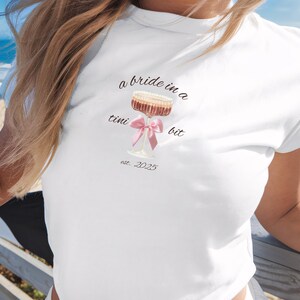 A Bride In A Tini Bit Baby Tee, Custom Martini Bachelorette Party CropTop, Coquette Martini Bride Tee, Gift For Bridesmaid, Future Mrs Shirt
