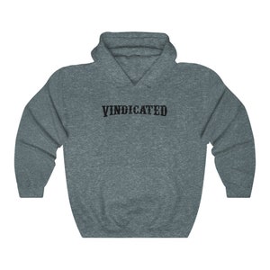 May include: A dark grey hooded sweatshirt with the word "VINDICATED" printed in black on the front.