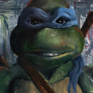 May include: A close-up portrait of a Teenage Mutant Ninja Turtle, painted in a realistic style. The turtle is wearing a blue bandana and has a green face with a sly smile. The background is a blurry cityscape.