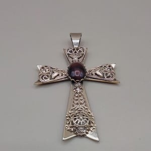 Large gold metal cross pendant with tiger eye stone