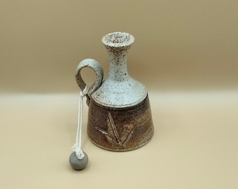 Stoneware ceramic vessel with handle and stone plug