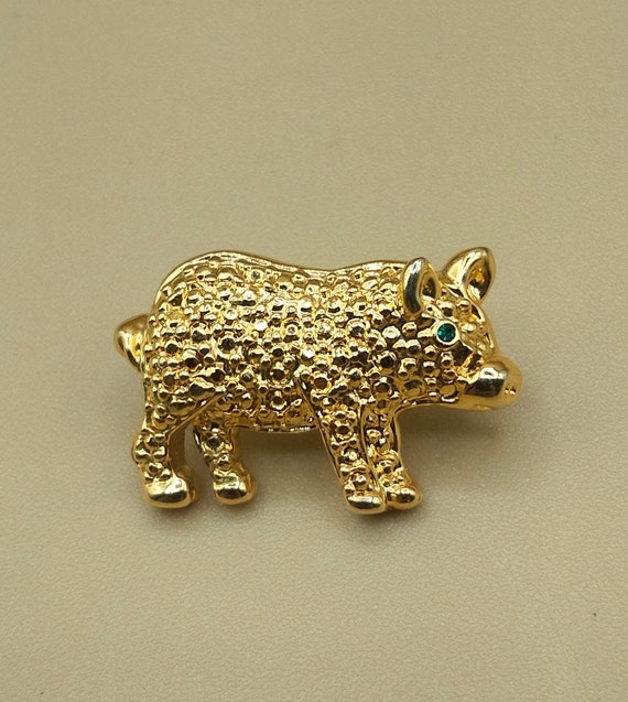 Gold pig figural pin in the manner of Swarovski