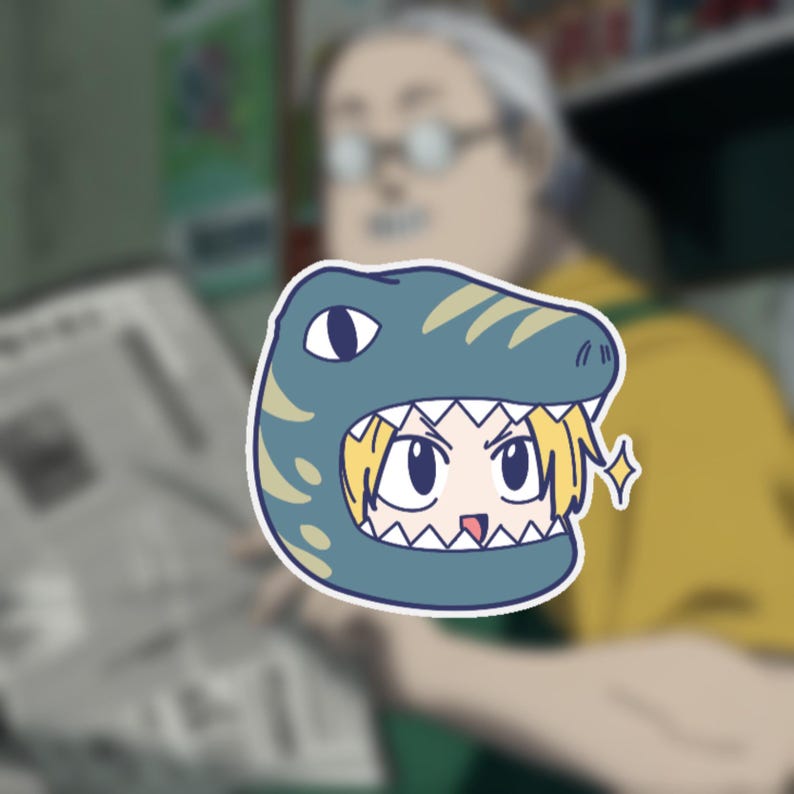 May include: A sticker featuring an anime-style character wearing a blue dinosaur hat. The character has blonde hair and is smiling. The sticker has a white border and a sparkling effect.