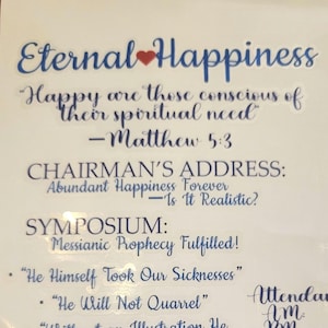 May include: A white paper with blue text, featuring the title "Eternal Happiness" with a heart symbol. The text includes quotes, the scripture Matthew 5:3, and the topics of a symposium, including "Messianic Prophecy Fulfilled!"