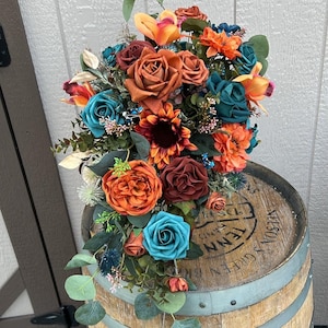 Cascade of shades of teal, burnt orange, peach, terracotta and cream