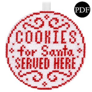 May include: A round, white cross-stitch ornament with red text that reads "COOKIES for Santa SERVED HERE." The ornament has a red border and a white ribbon for hanging. A black circle with "PDF" is in the upper right corner.