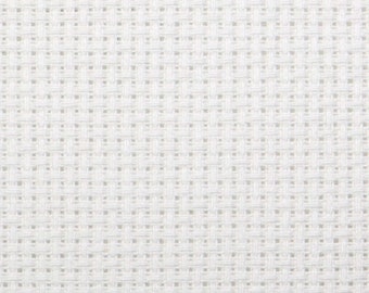 May include: White Aida cloth, a type of fabric used for cross-stitch embroidery. The fabric has a grid pattern and is commonly used for needlepoint projects.