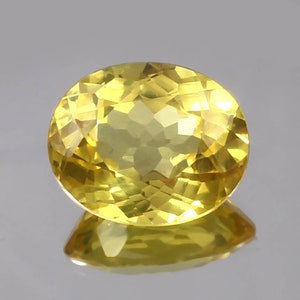 AAA Ceylon Yellow Sapphire: 12 Ct Oval Cut Gemstone