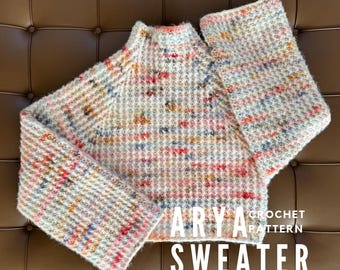 May include: A multi-colored crochet sweater with a high neckline and long sleeves. The sweater features a textured stitch pattern with flecks of red, blue, yellow, and pink. The text "ARYA CROCHET PATTERN SWEATER" is displayed in white block letters.