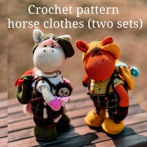 May include: Two crocheted horse toys wearing clothes. The horse on the left is white with a brown and green plaid outfit and a green hat. The horse on the right is orange with a brown and yellow plaid outfit and a yellow hat. Both horses are holding small crocheted toys.