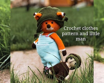 May include: A crocheted fox wearing a green hat and blue dungarees holds a smaller crocheted figure in a green hat. The text "Crochet clothes pattern and little man" is visible in the image.