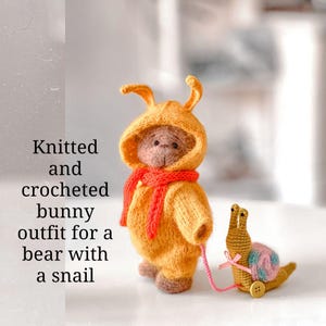 Knitted and crocheted bunny outfit for a bear with a snail