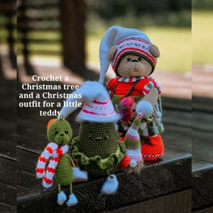 May include: Crochet Christmas tree, teddy bear, and a smaller teddy wearing a Christmas outfit. The tree is green with white trim and the teddy bear is wearing a red and white striped hat and a red and white striped outfit. The smaller teddy is wearing a red and white striped scarf and a white hat.
