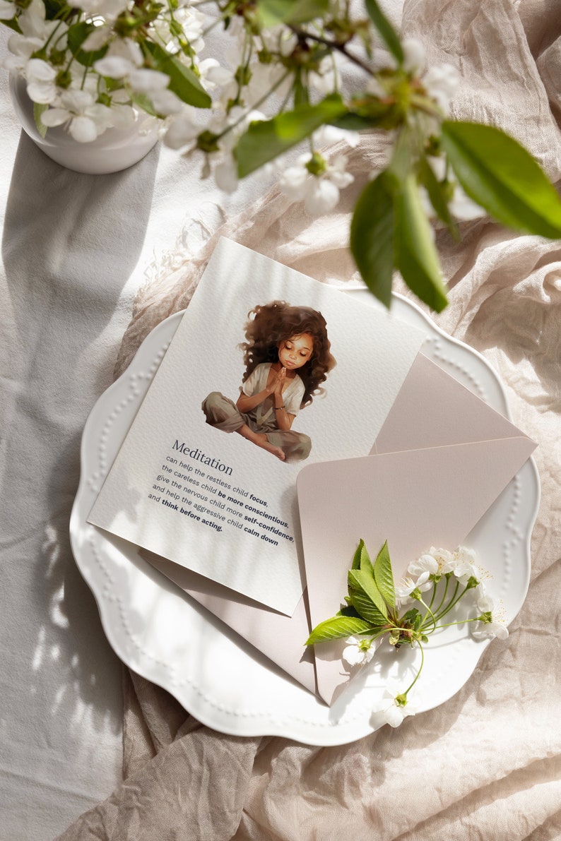 May include: A white card with a watercolor illustration of a young girl meditating. The card has the word "Meditation" and a description of the benefits of meditation for children.