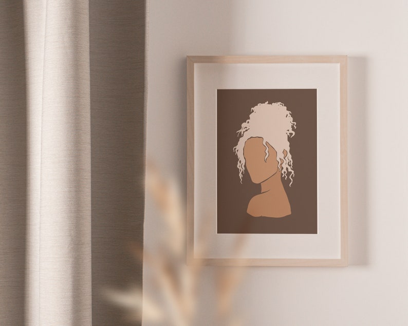 May include: A framed illustration of a person with blonde curly hair, a brown face, and a brown background.