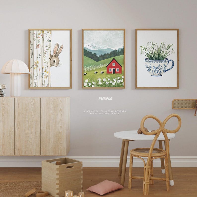 May include: Three framed illustrations for a nursery or child's room. The first shows a rabbit peeking out from behind a tree. The second shows a red house in a green field with white flowers. The third shows a white teacup with blue and green floral designs filled with white flowers.