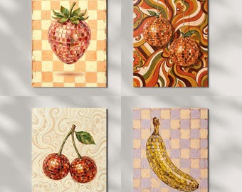 May include: Four square canvas art prints featuring fruit designs. A strawberry, cherries, and a banana are depicted with a mosaic tile effect. Two disco ball ornaments hang from a retro-style background. The color palette includes orange, red, yellow, and green.
