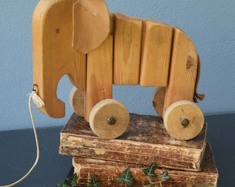 Figura de elefante articulada de madera tallada para arrastrar, juguete antiguo