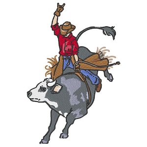 May include: A cowboy in a red shirt and blue jeans rides a bucking bull. The bull is gray and white with a brown saddle. The cowboy is holding onto the bull's horns with one hand and raising his other hand in the air.