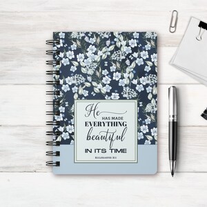 May include: A blue spiral bound journal with a floral pattern and the quote "He has made everything beautiful in its time - Ecclesiastes 3:11".