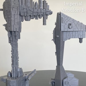 May include: Two grey 3D printed models of the Nebulon-B starship from Star Wars. The larger model is 20 inches tall and labelled "20" Nebulon-B". The smaller model is 15 inches tall and labelled "15" Imperial Nebulon-B".