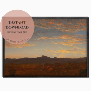 Puede incluir: Una impresión digital de una pintura de paisaje que representa una cordillera al atardecer. El cielo es de un naranja y rosa vibrantes, con nubes que proyectan largas sombras sobre las colinas. El primer plano es un campo de hierba marrón.