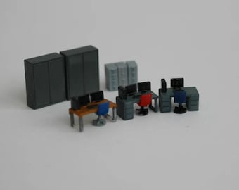 May include: A miniature office set with gray cabinets, desks, and chairs. The set includes two computer monitors, a keyboard, and a mouse. The set is made of plastic and is approximately 1:12 scale.