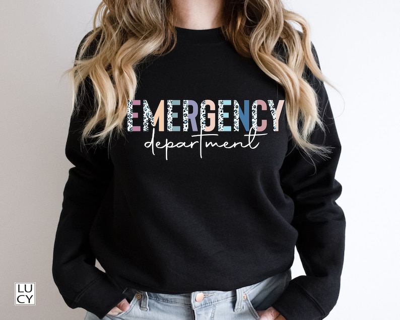 May include: Black sweatshirt with the text "EMERGENCY department" in colorful letters with a leopard print pattern.