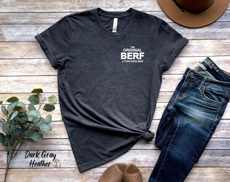 May include: Dark gray heather t-shirt with the text "The Original Berf of Chicagoland" printed on the front.