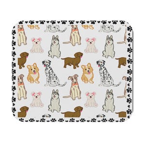 May include: A white ceramic mug with a black handle and the text "But First, Coffee" in a bold, black font. The mug is set against a neutral background, highlighting its simple design.