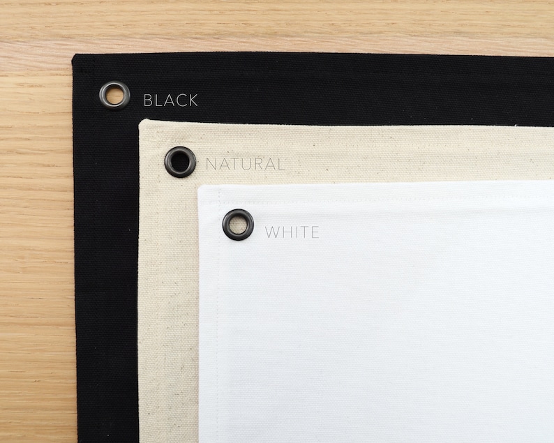 May include: Three fabric swatches with grommets, labeled "BLACK", "NATURAL", and "WHITE".