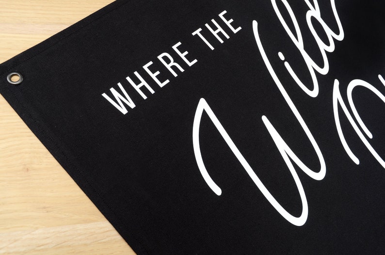 May include: Black canvas banner with white text that reads "Where the Wild Things Are".