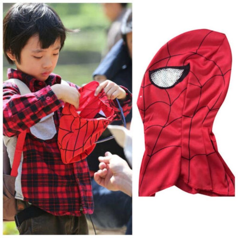 Op de afbeelding: Rood en zwart Spiderman-masker met een gaasoogopening. Het masker is gemaakt van zacht materiaal en heeft een capuchon.