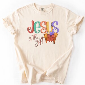 Jesus is the gift, Christmas Christian PNG, Jesus Christmas T-Shirt Sublimation Design, Digital Painted text hand drawn baby Jesus&#39; manger