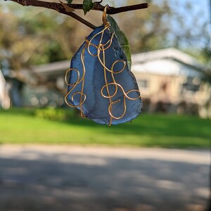 Blue beach glass wire wrapped pendant