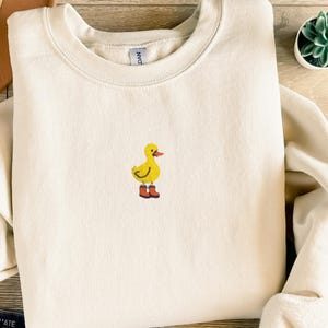 Duck Embroidered Sweatshirt: Cozy Unisex Crewneck - Ethically Grown Cotton