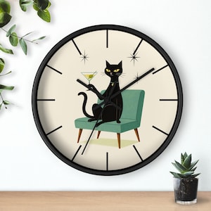 May include: Black wall clock with a retro design. The clock face features a black cat sitting in a teal chair, holding a martini. The clock has a black frame and black hands. The clock is a decorative item.