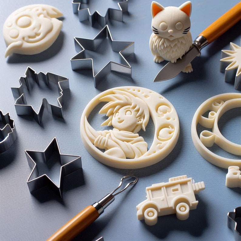 May include: A collection of cookie cutters in various shapes, including stars, moons, and a crescent moon. There is also a small white ceramic figurine of a cat, a small white ceramic figurine of a person, and a wooden tool for crafting.