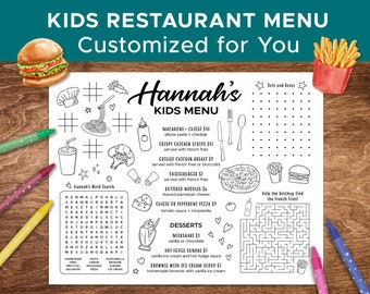 May include: Black and white printable kids menu with a cartoon burger, fries, pizza, and pasta. The menu includes a word search, a maze, and a dots and boxes game. The menu is titled "Hannah's Kids Menu" and features items like macaroni and cheese, crispy chicken strips, grilled chicken breast, cheeseburger, and pizza. Desserts include milkshake, hot fudge sundae, and brownie with ice cream.