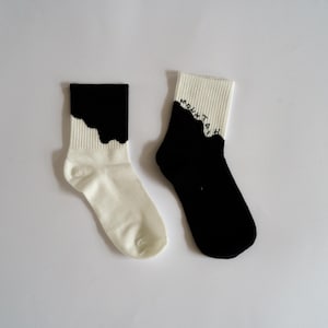 Mountain outdoor socks - perfect for climbers, hikers, and outdoor lifestyle. Black and white pair of socks in mountain theme (crew socks)
