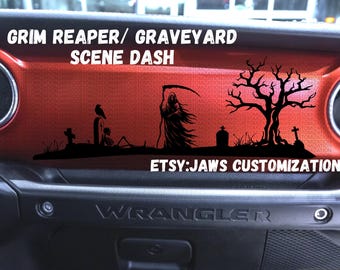 May include: A black and white graphic decal of a Grim Reaper, a graveyard scene, and a tree. The decal is on a red car dashboard with the text "GRIM REAPER/GRAVEYARD SCENE DASH" and "ETSY:JAWS CUSTOMIZATION".
