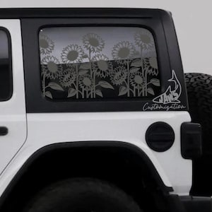 May include: A white Jeep with a black top and a window decal featuring a field of sunflowers. The decal is a light gray color and the text "JAWS Customization" is visible on the window.