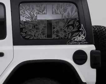 May include: A white Jeep Wrangler with a black cross and floral design on the rear window. The design is a custom vinyl decal with the text "JAWS Customization" below it.