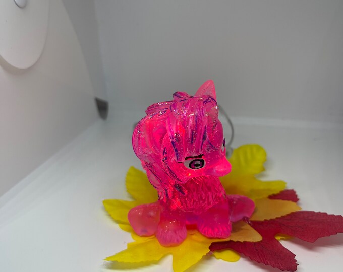Cute baby unicorn that is pink and hand-painted with red LED lights free black light keychain